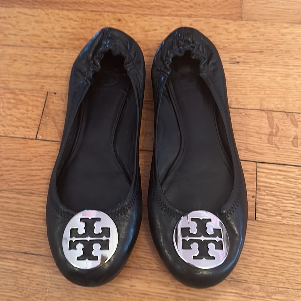 Black Tory butch flats with silver logo